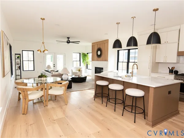 a very nice looking dining room with furniture and window