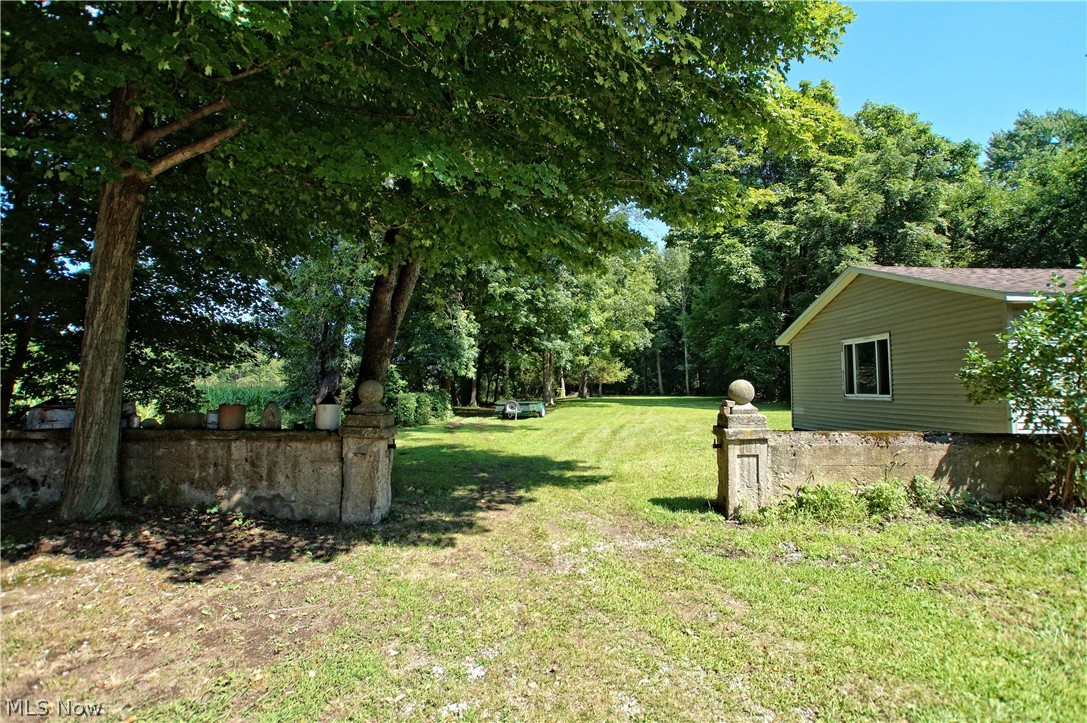 2586 County Line Road Madison, OH 44057 - Photo 27 of 31 Remnants of the home's history are scattered on the property-including this estate wall...