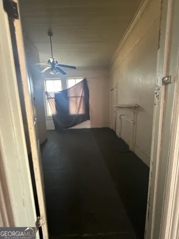 a view of empty room with windows