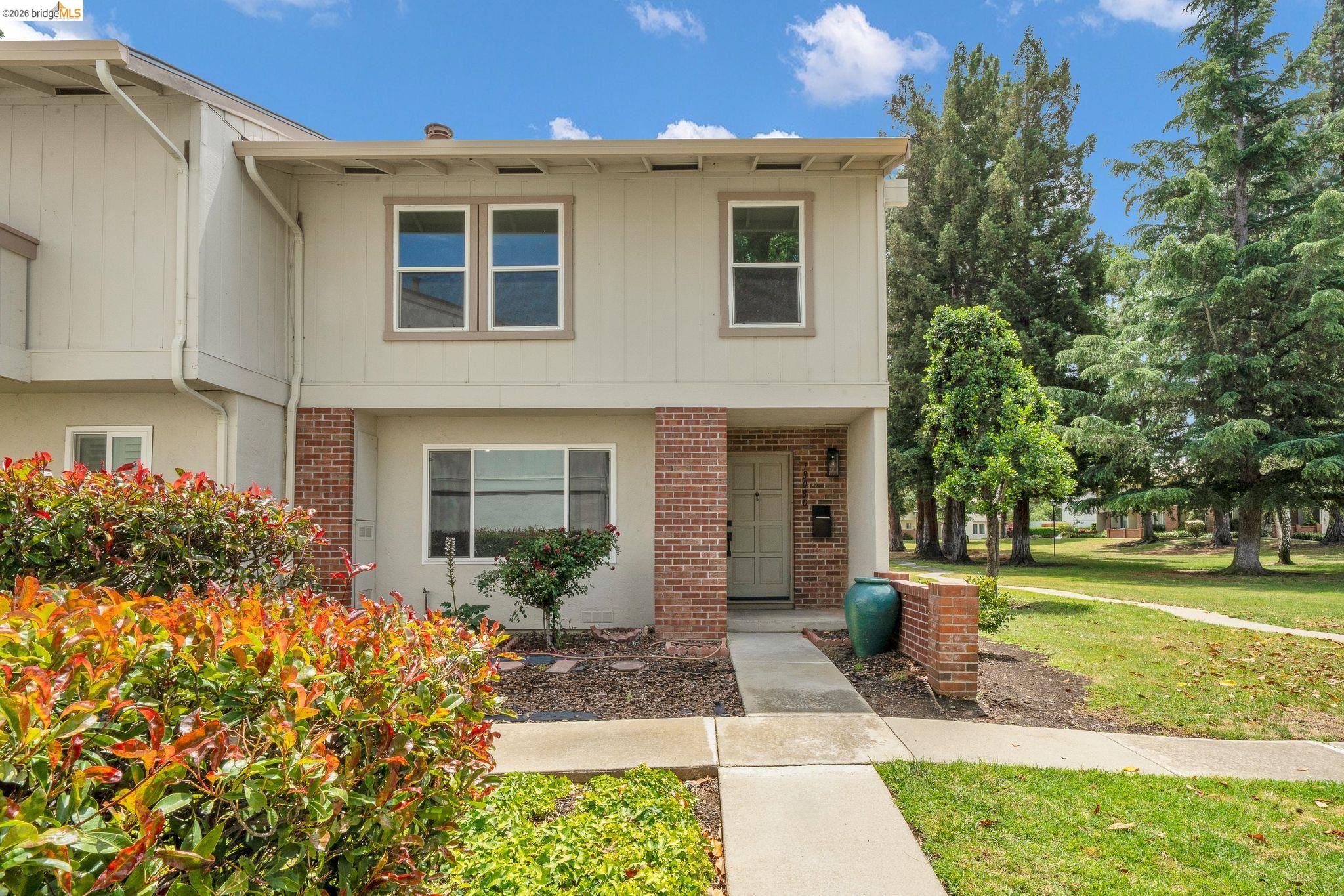 1808 Wildbrook Court, Unit D Concord, CA 94521 - Photo 1 of 47 a front view of a house with garden