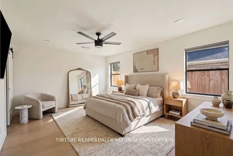 a bedroom with a bed a couch and dresser