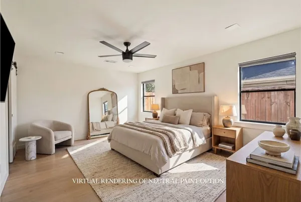 a bedroom with a bed a couch and dresser