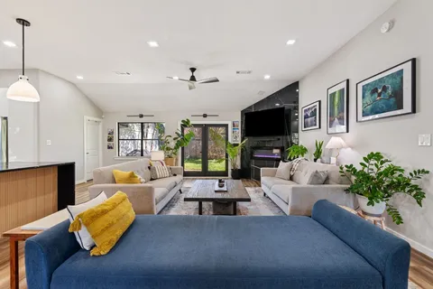 a living room with furniture and a flat screen tv