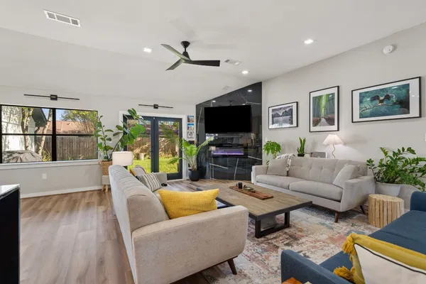 a living room with furniture and a flat screen tv