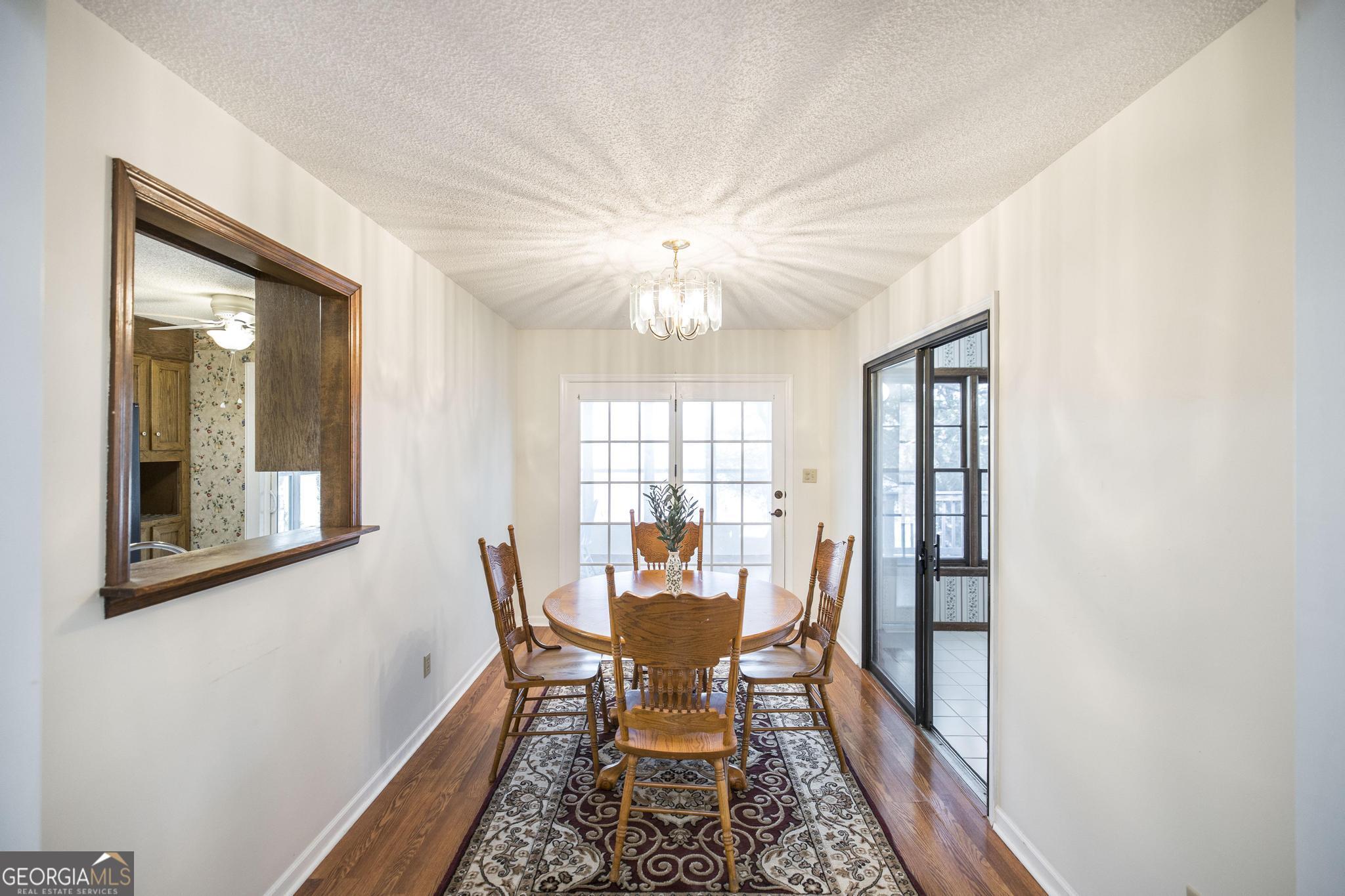 240 Mossland Drive Perry, GA 31069 - Photo 17 of 36 a dining room with furniture and window