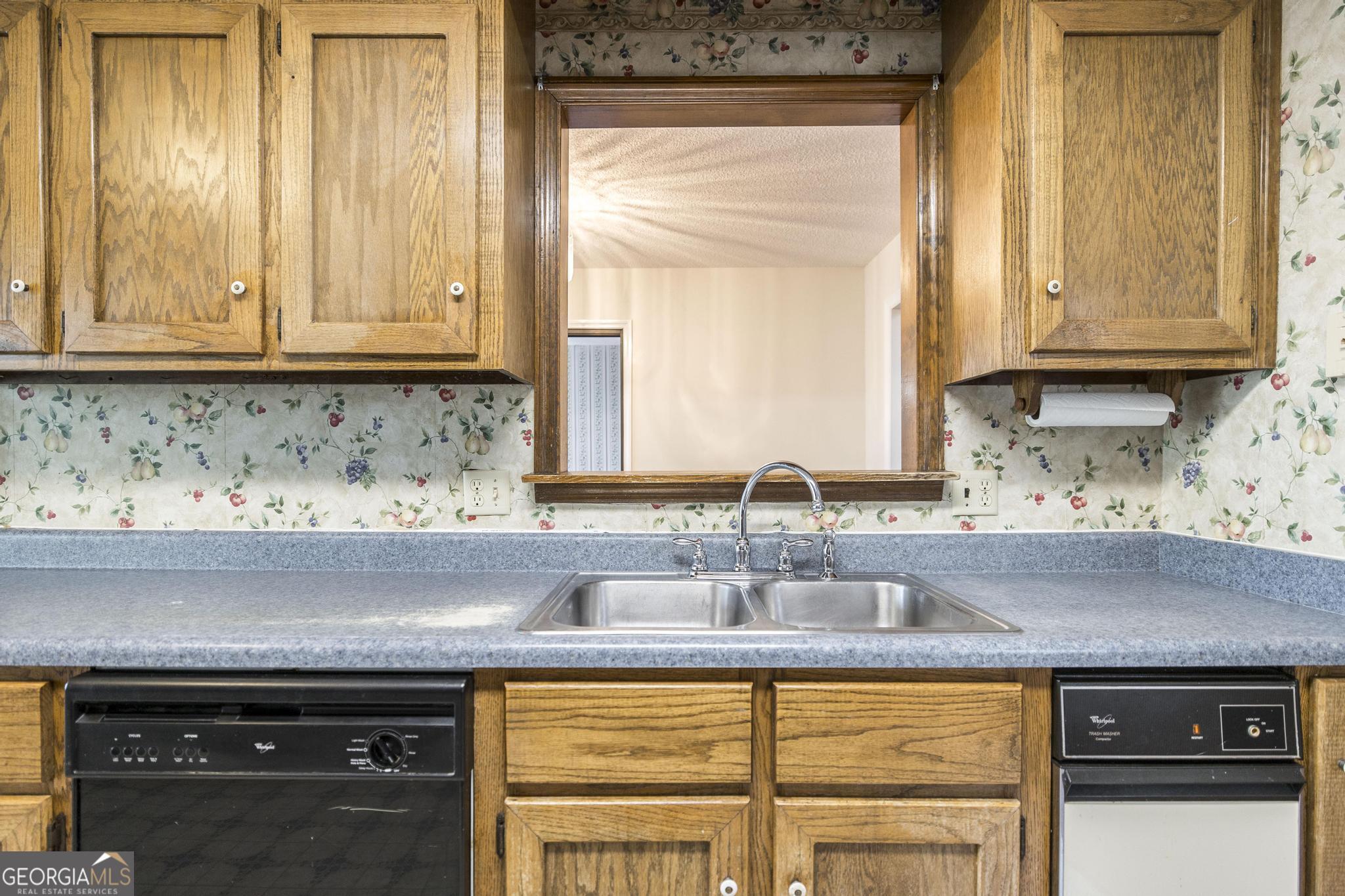 240 Mossland Drive Perry, GA 31069 - Photo 20 of 36 a kitchen with a sink and a window