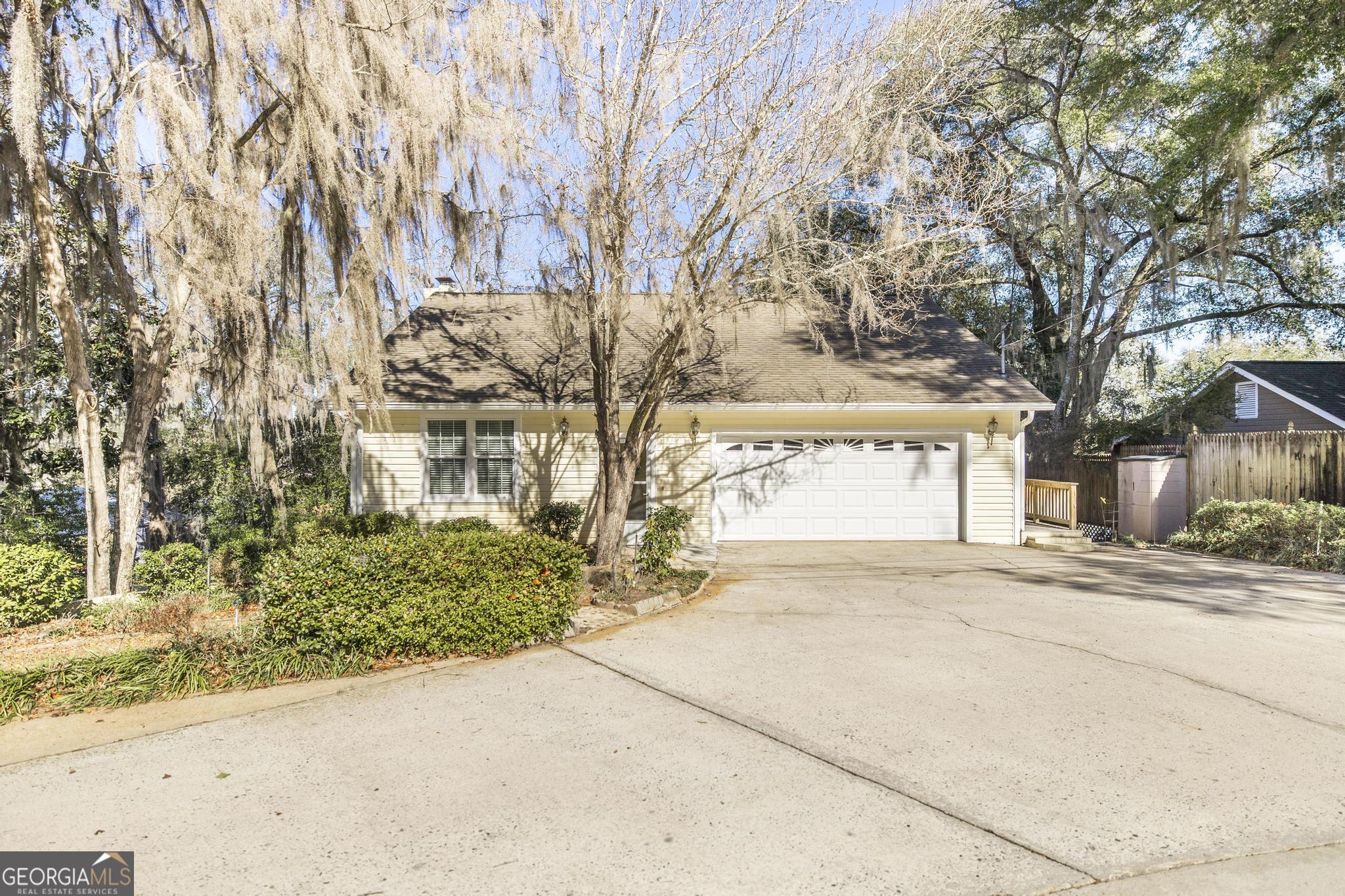 240 Mossland Drive Perry, GA 31069 - Photo 2 of 36 front view of a house with a yard and an trees