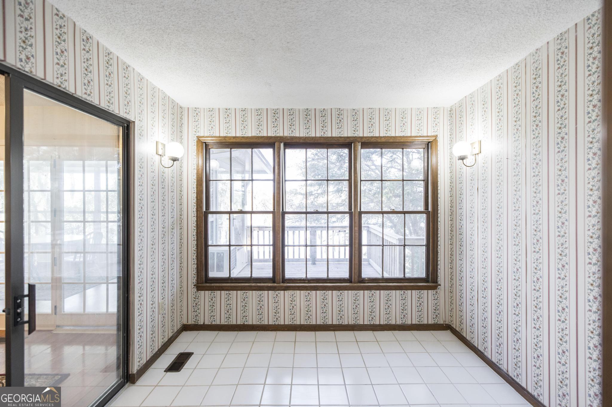240 Mossland Drive Perry, GA 31069 - Photo 25 of 36 a view of an empty room with a window