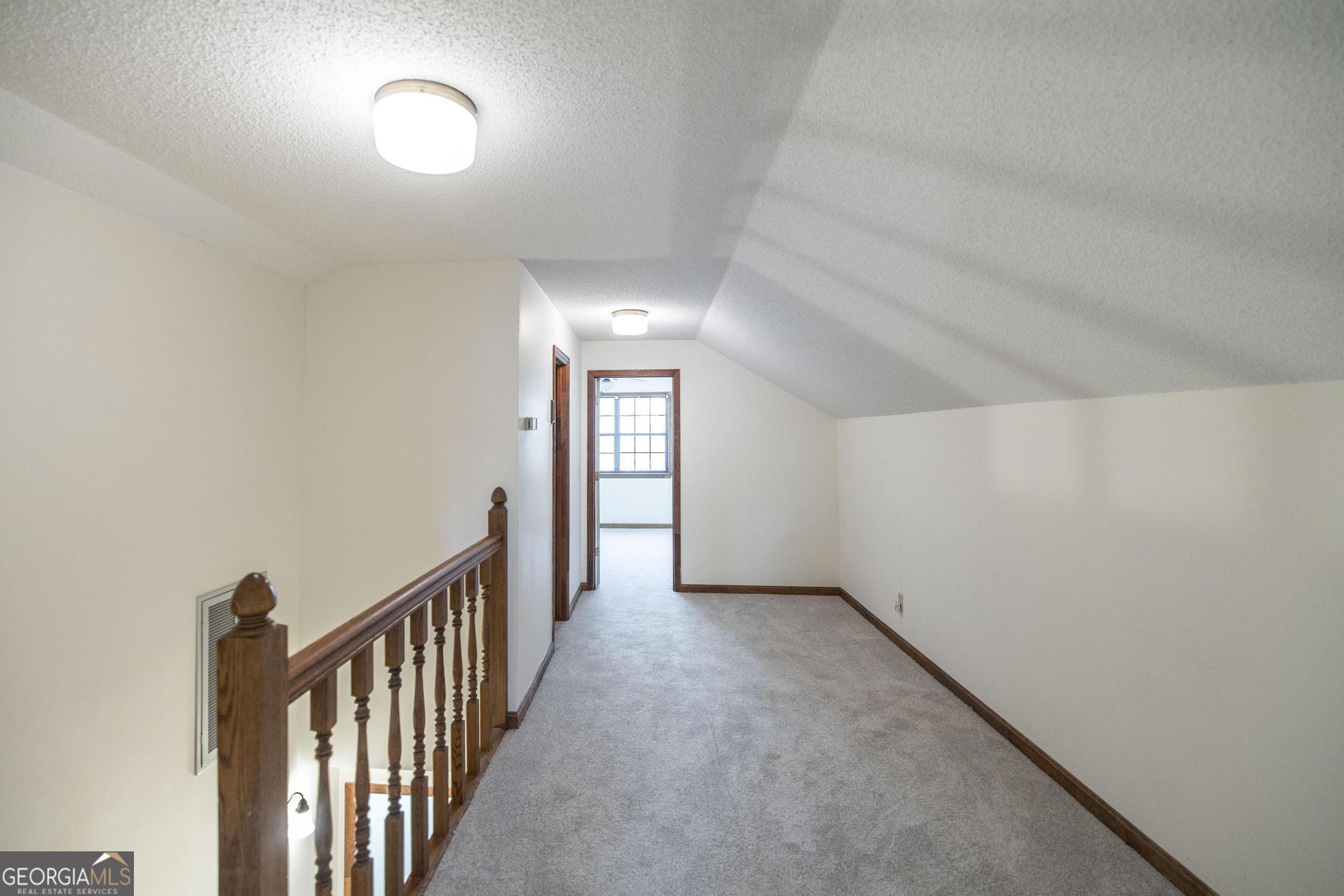 240 Mossland Drive Perry, GA 31069 - Photo 26 of 36 wooden floor in a hall with a window