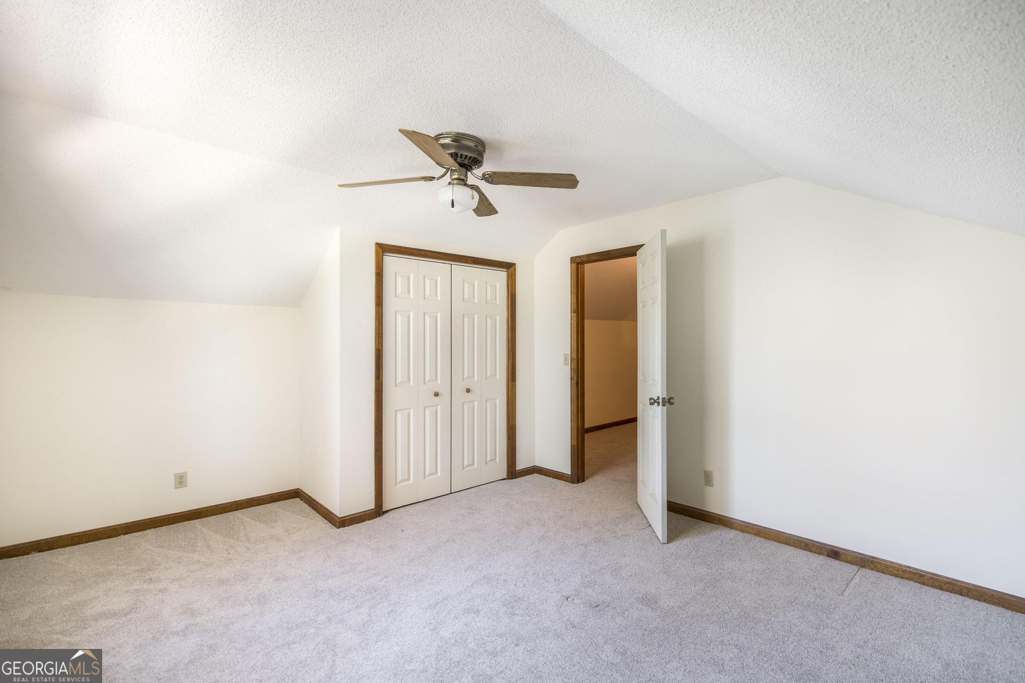 240 Mossland Drive Perry, GA 31069 - Photo 28 of 36 a view of room with a ceiling fan