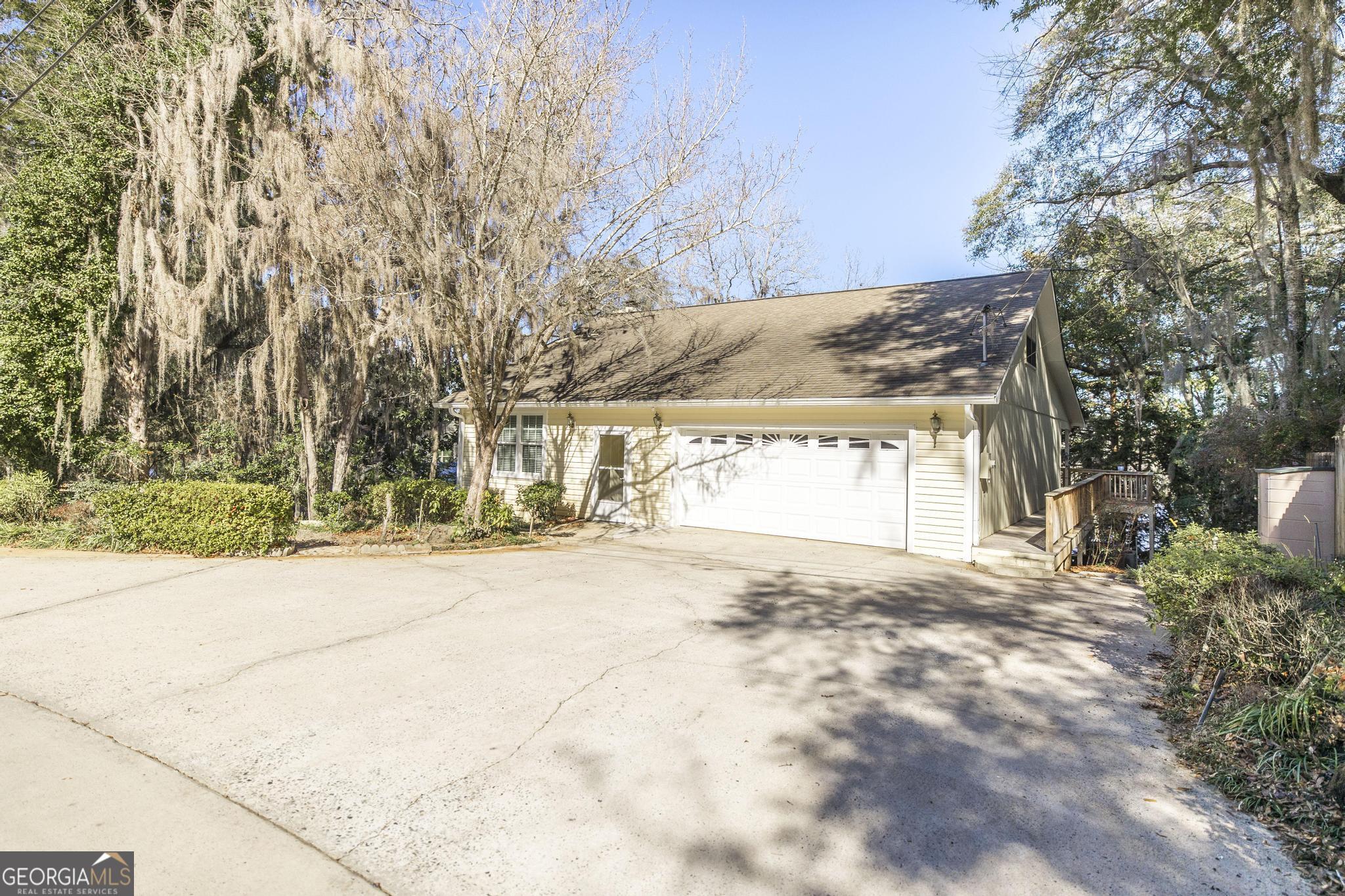 240 Mossland Drive Perry, GA 31069 - Photo 6 of 36 a view of parking and sign board