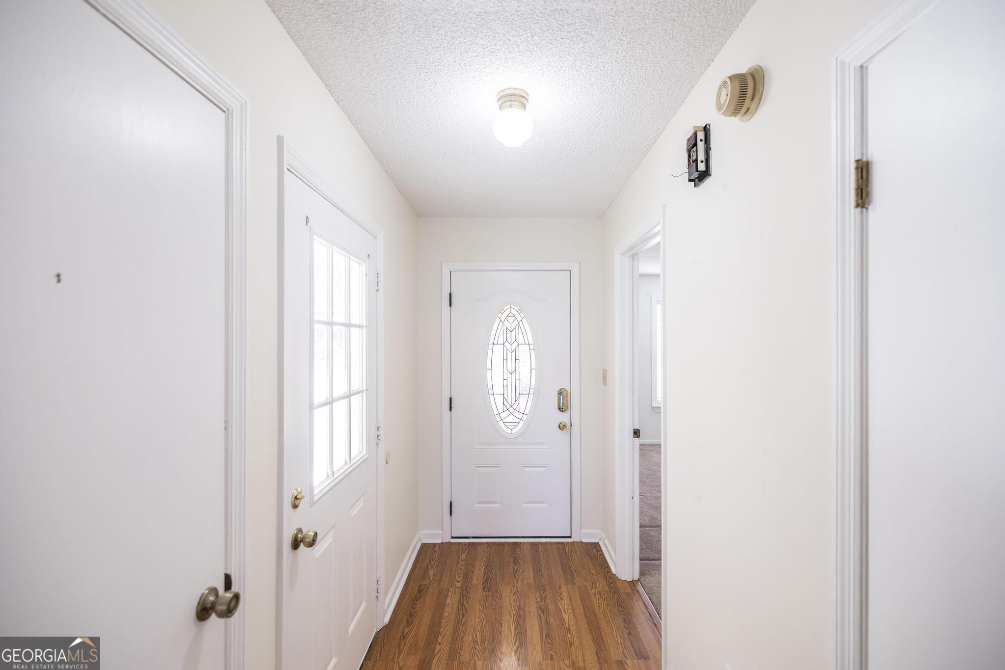 240 Mossland Drive Perry, GA 31069 - Photo 10 of 36 a view of a bathroom from a hallway