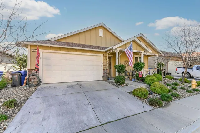 a view of a patio with table and chairs