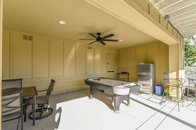 a view of balcony with furniture and garden