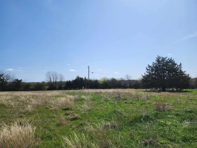 a view of a lake with houses in the background