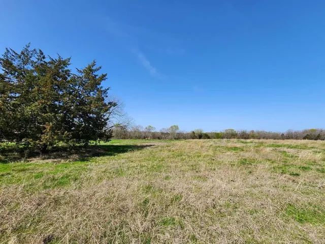 a view of a lake and sunset