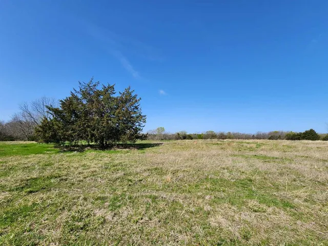 a view of an ocean beach and mountain