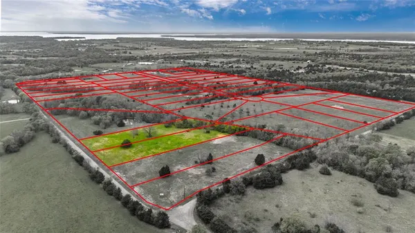 an aerial view of a pool table and chairs