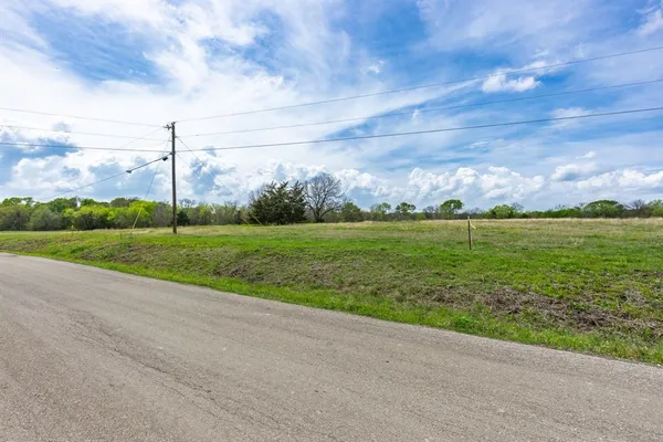 a view of a golf course with a big yard