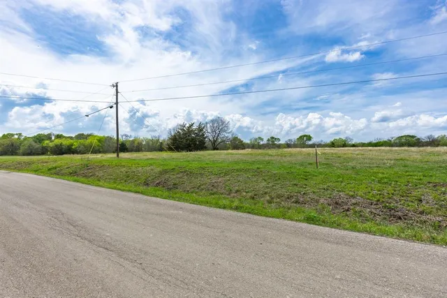 a view of a golf course with a big yard
