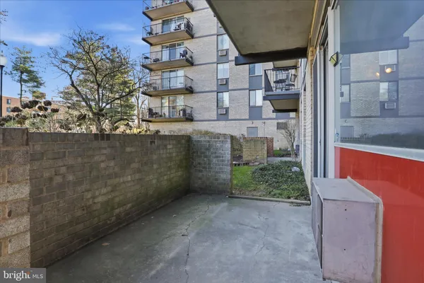 a view of a brick house with a outdoor space