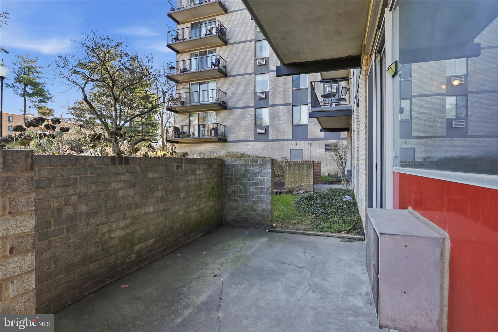 3245 Rio Drive, Unit 107 Falls Church, VA 22041 - Photo 18 of 32 a view of a brick house with a outdoor space