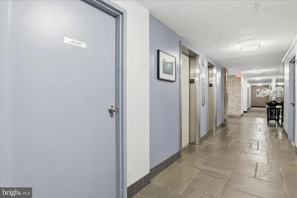 a bathroom with a glass door shower