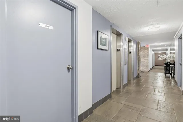 a bathroom with a glass door shower