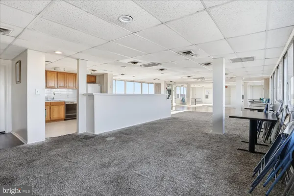 a view of a kitchen with furniture and a window