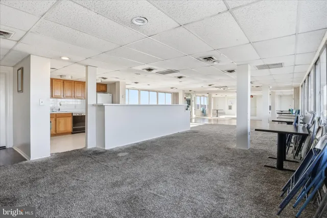 a view of a kitchen with furniture and a window