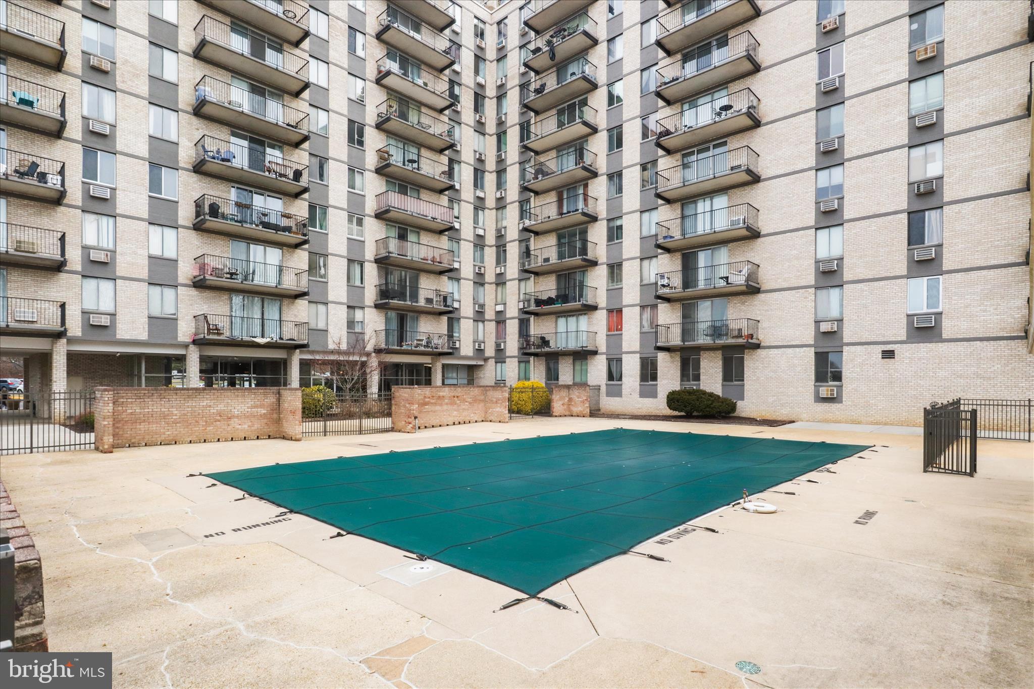3245 Rio Drive, Unit 107 Falls Church, VA 22041 - Photo 26 of 32 a view of a building with garden