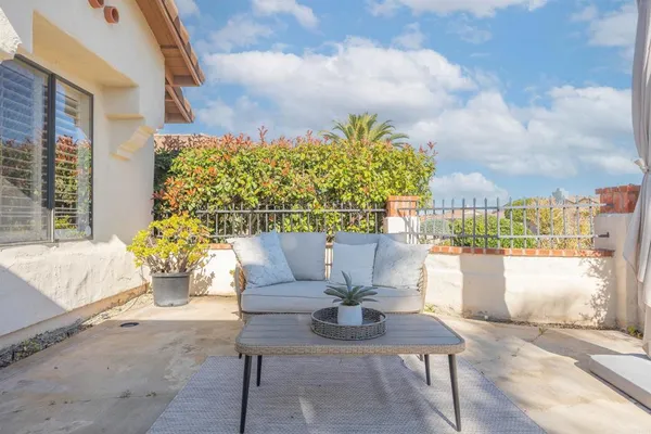 a view of a balcony with chair and table