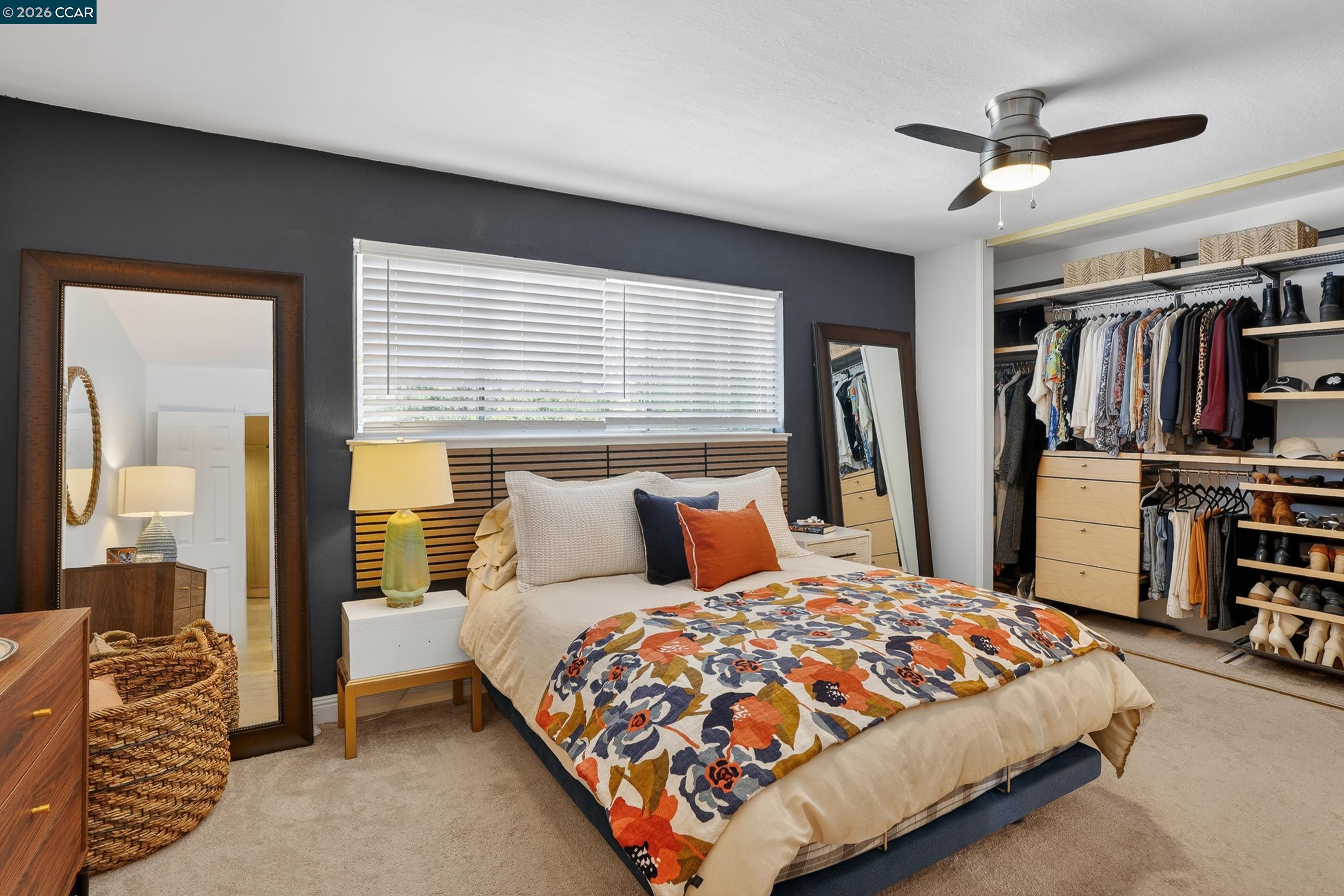 1812 Wildbrook Court, Unit C Concord, CA 94521 - Photo 8 of 35 a bedroom with a large bed and a chandelier