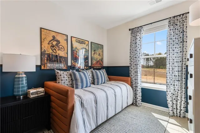 a spacious bedroom with a large bed and a window