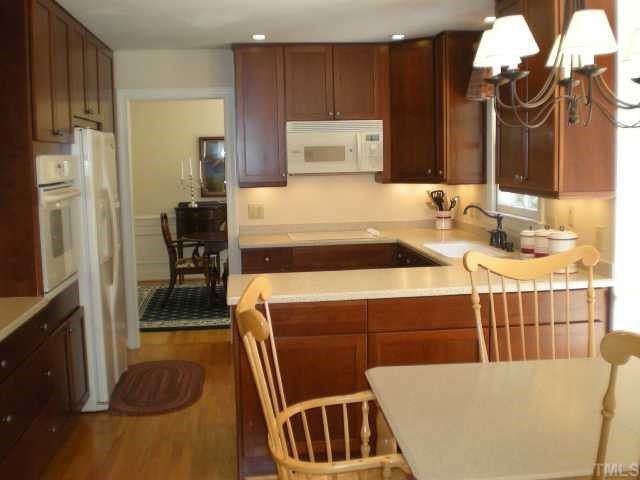 10112 Peridot Lane Raleigh, NC 27615 - Photo 6 of 12 Updated kitchen is open to the breakfast nook. Kitchen