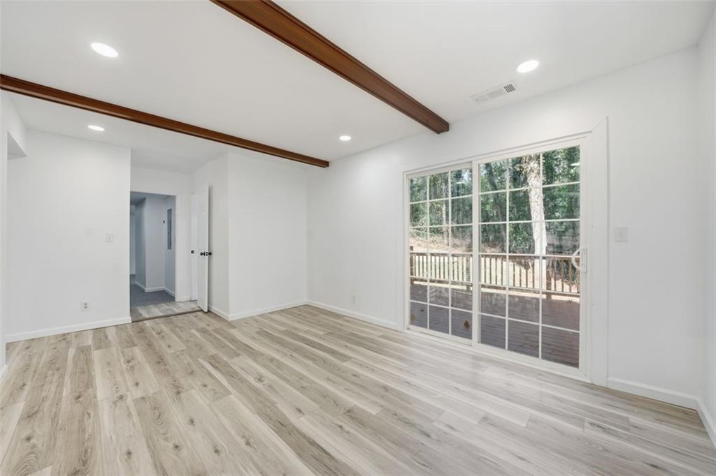3920 Wedgefield Circle Decatur, GA 30035 - Photo 16 of 25 a view of empty room with wooden floor and fan