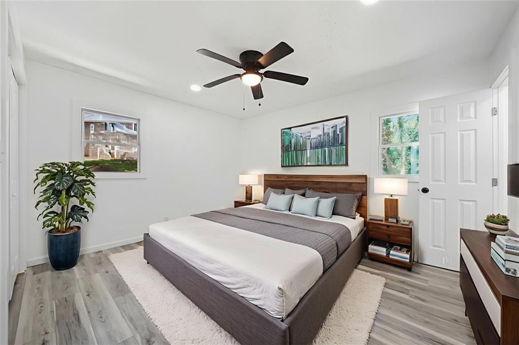 3920 Wedgefield Circle Decatur, GA 30035 - Photo 7 of 25 a bedroom with a bed and a chandelier