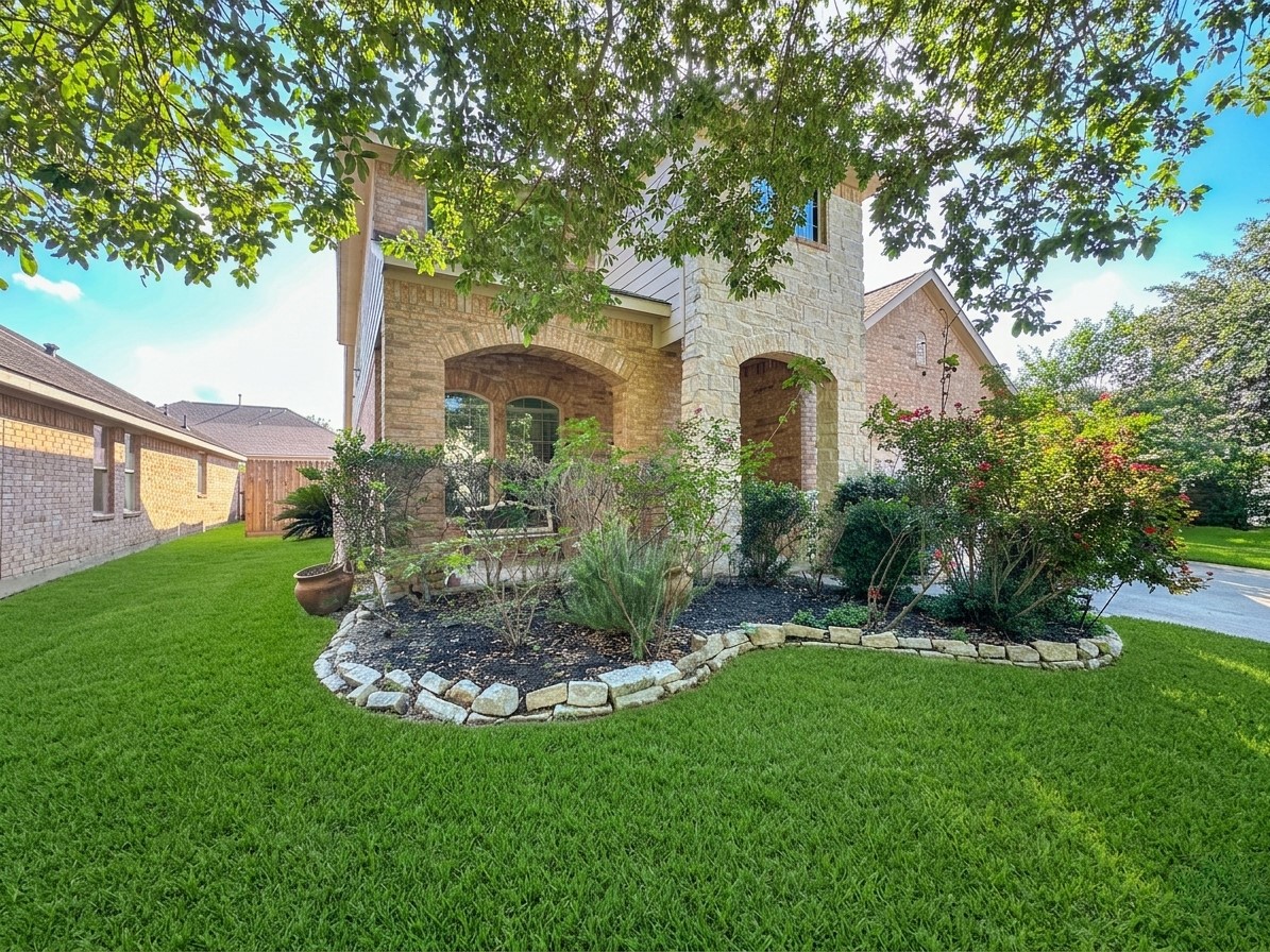 20319 Little Wing Drive Spring, TX 77388 - Photo 5 of 49 a front view of a house with garden