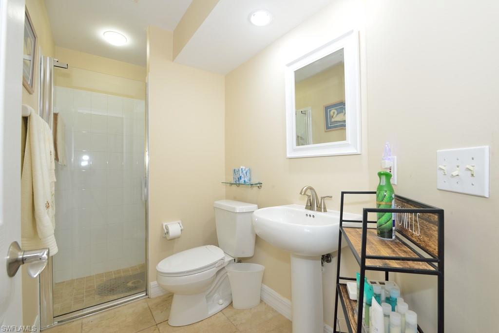 106 Cypress View Drive, Unit C8 Naples, FL 34113 - Photo 16 of 30 a bathroom with a sink toilet and shower
