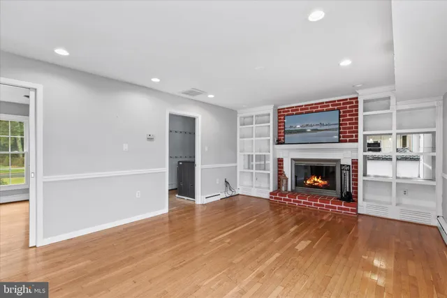 a view of kitchen with refrigerator sink and stove