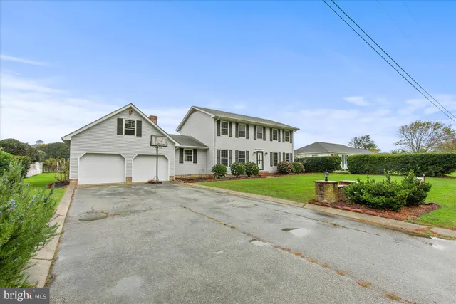 a kitchen with granite countertop a sink a counter space appliances and cabinets