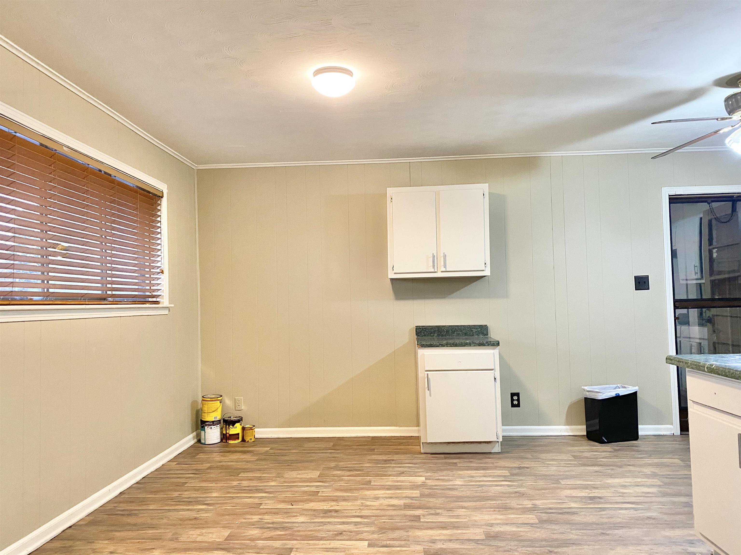 3536 West Horn Lake Road Memphis, TN 38109 - Photo 7 of 12 a view of a kitchen with wooden floor and a sink