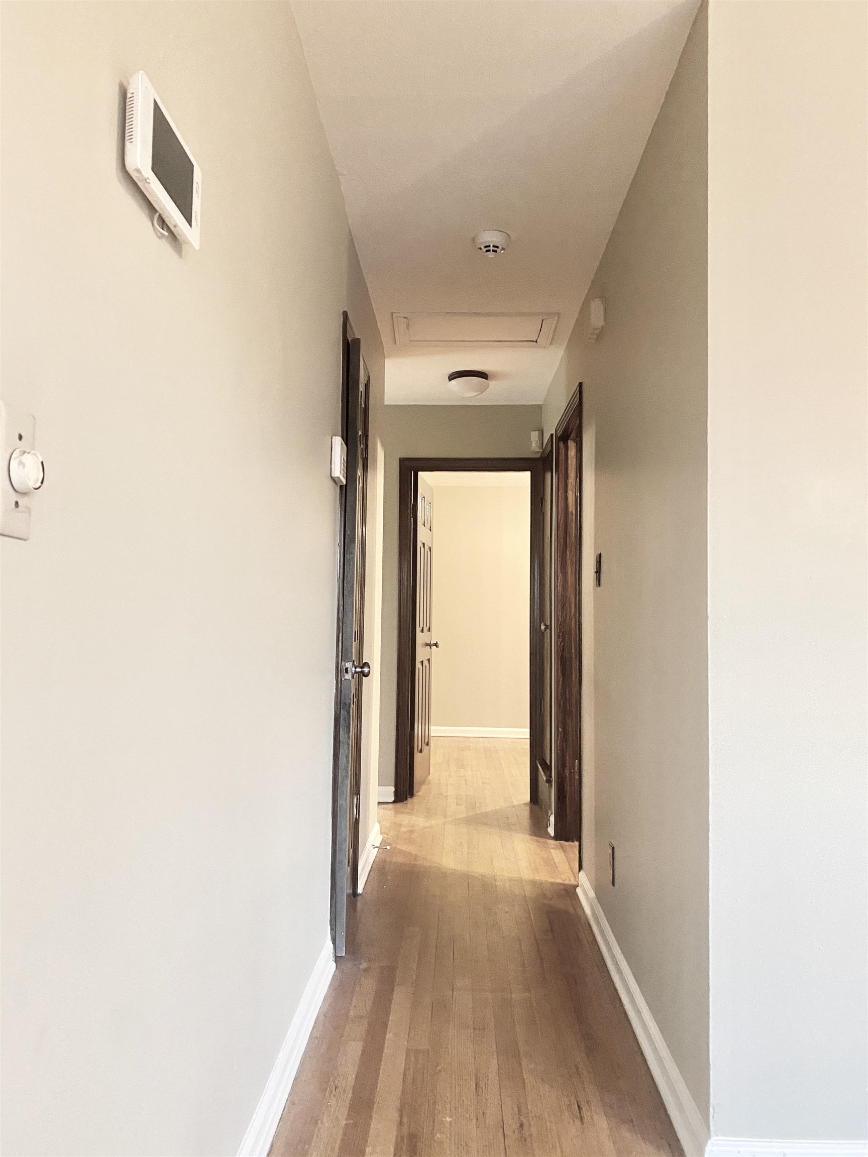 3536 West Horn Lake Road Memphis, TN 38109 - Photo 8 of 12 a view of a hallway with wooden floor