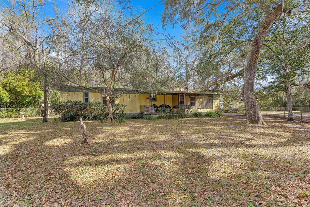 3175 Northeast 162nd Street Citra, FL 32113 - Photo 1 of 1 a view of a yard with a tree