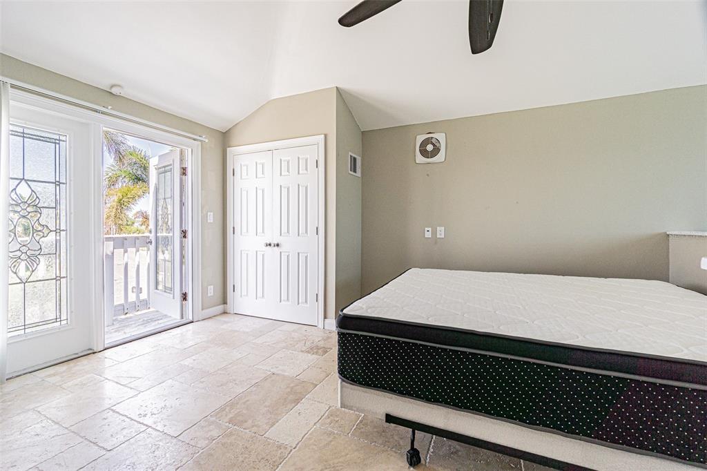 121 Wall Street Redington Shores, FL 33708 - Photo 22 of 38 a room with a bed and a window