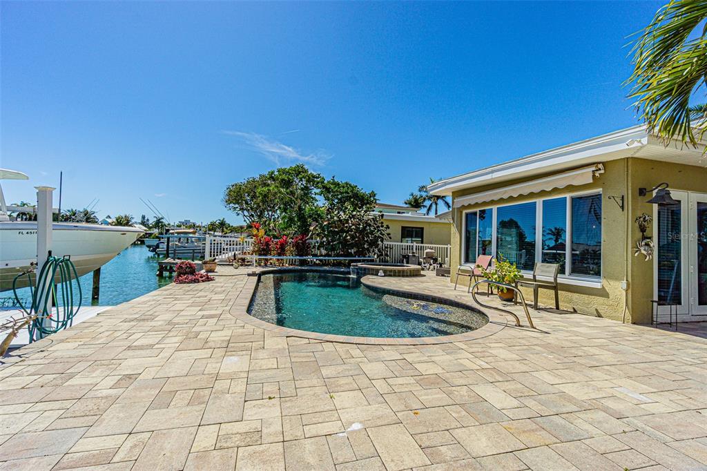 121 Wall Street Redington Shores, FL 33708 - Photo 27 of 38 a swimming pool with outdoor seating and yard
