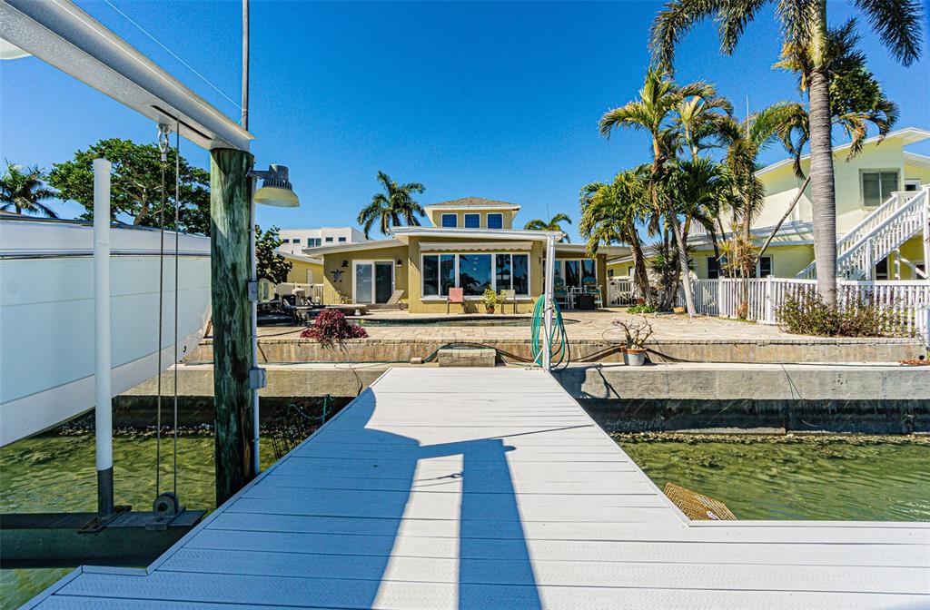 121 Wall Street Redington Shores, FL 33708 - Photo 29 of 38 a view of a yard and front view of a house