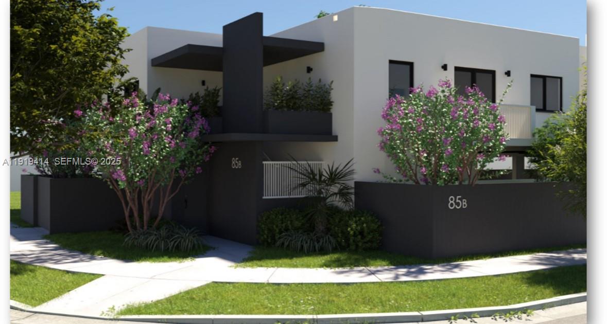 85 Northeast 55th Street, Unit 3 Miami, FL 33137 - Photo 2 of 15 a front view of a house with a yard