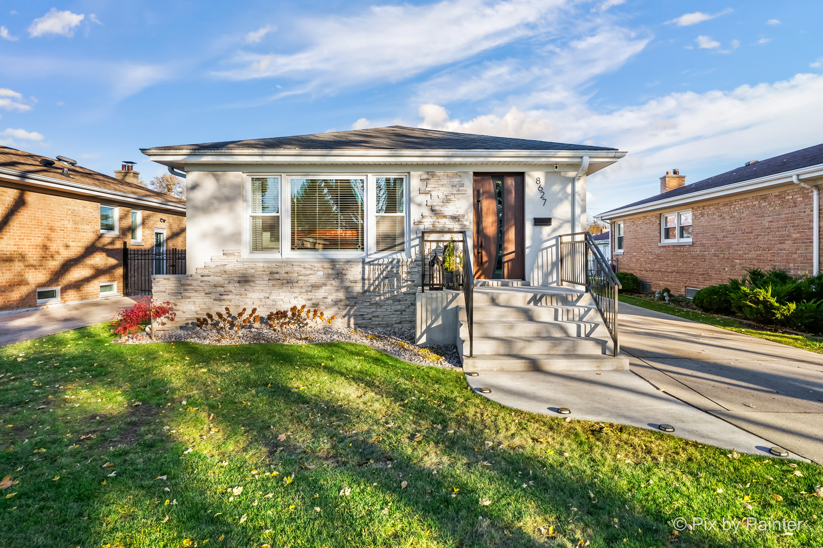 a view of a house with backyard sitting area and garden