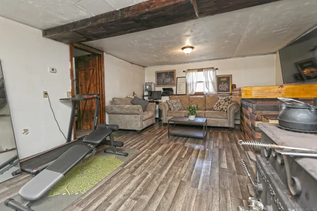 a living room with furniture and flat screen tv